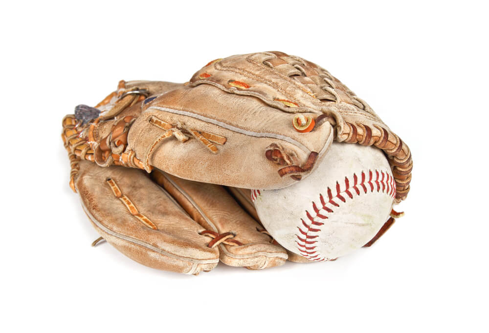 ball and glove against a white background